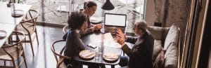 Businesspeople Having Meeting In A Restaurant.