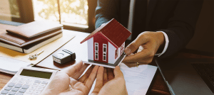 real estate agent and home buyer purchasing house